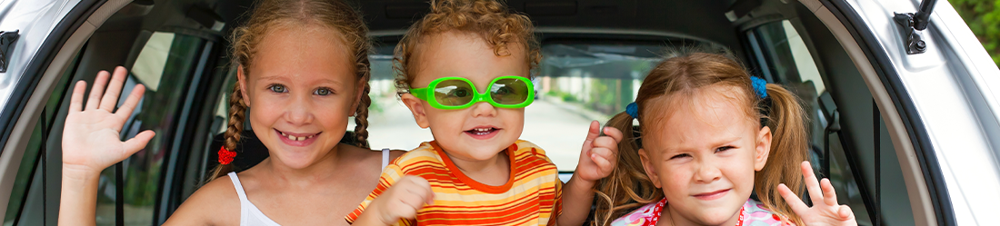 Happy family arriving at the airport with Fox Rent a Car
